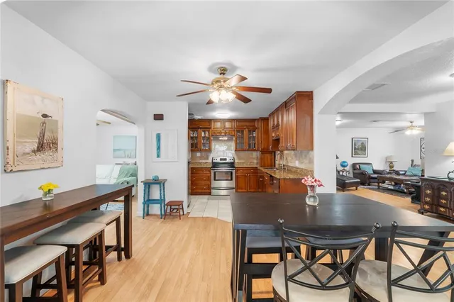 a dining room with furniture and wooden floor
