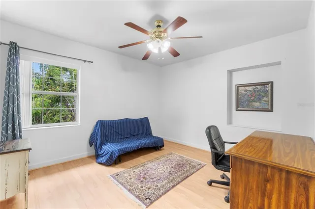 a work room with furniture and a window