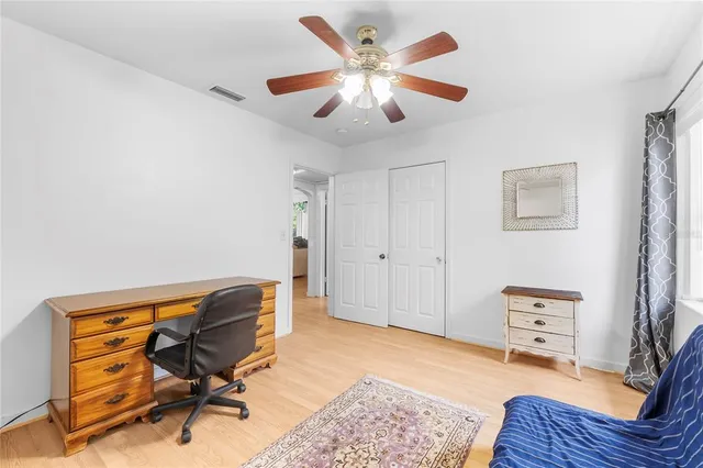 a bedroom with furniture and a rug