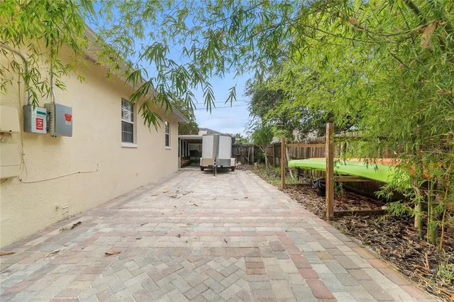 a pathway of a house with a yard