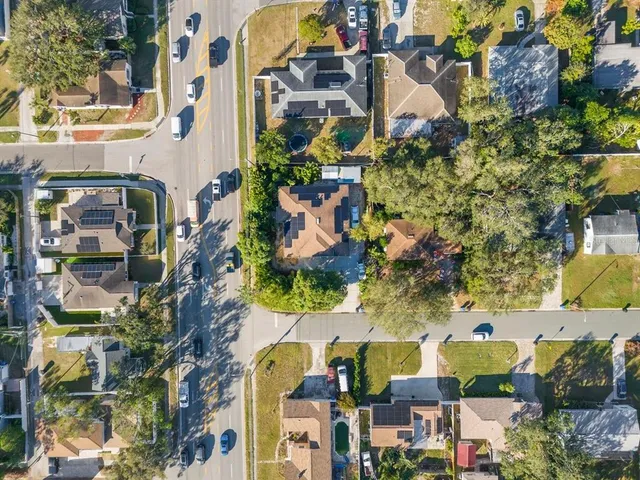 an aerial view of residential houses with outdoor space