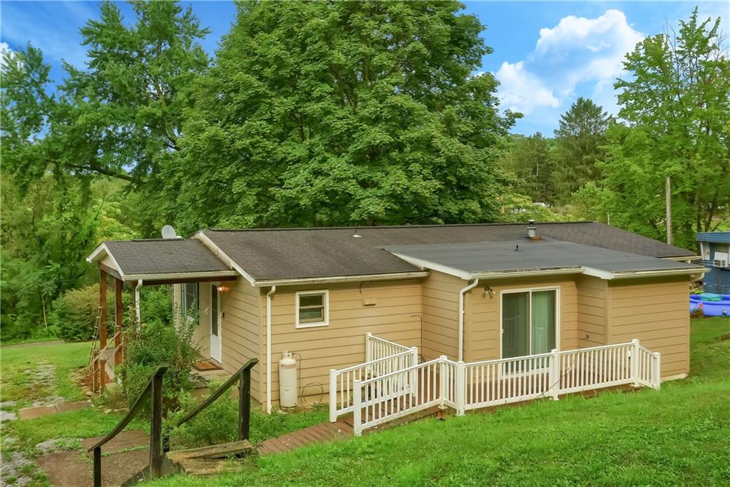 113 Moores Road Aliquippa, PA 15001 - Photo 22 of 25 a aerial view of a house with a yard table and chairs