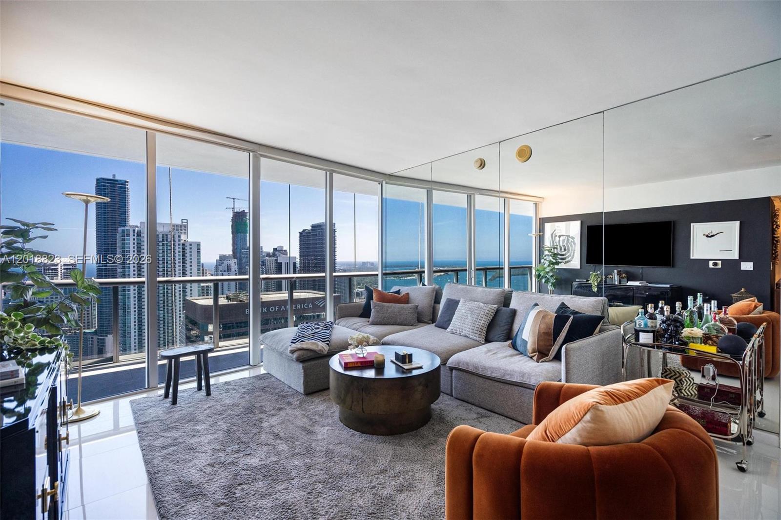 495 Brickell Avenue, Unit 4911 Miami, FL 33131 - Photo 5 of 35 a living room with furniture and a flat screen tv