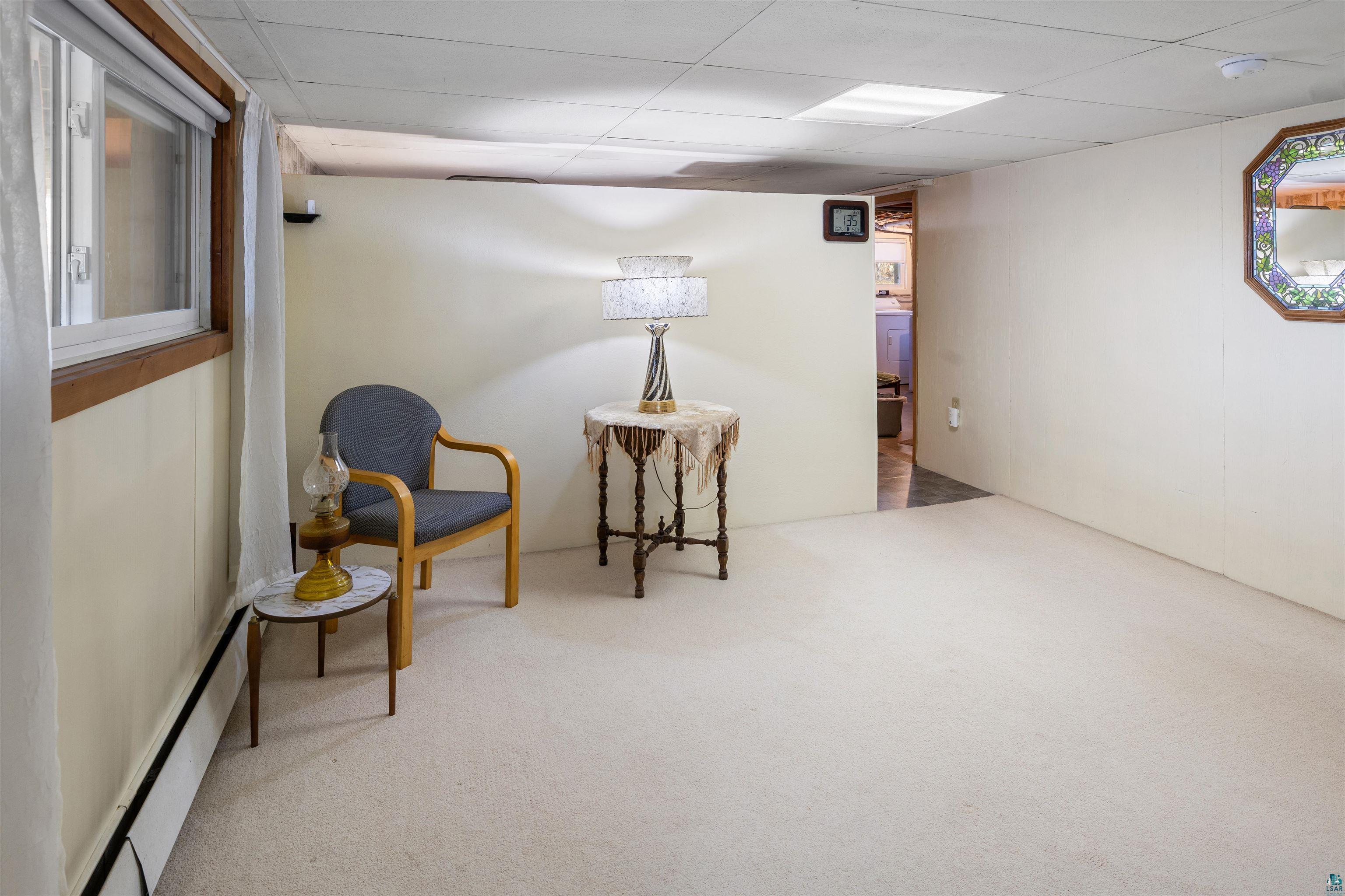 3975 Long Lake Shores Road Eveleth, MN 55734 - Photo 56 of 84 Sitting room with light carpet and a drop ceiling