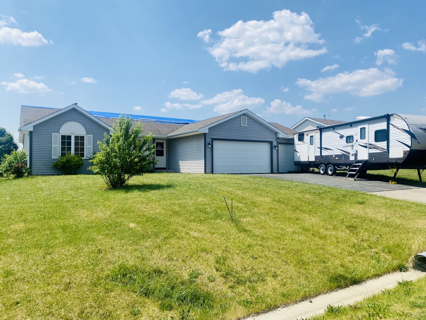 192 Prairie Moon Drive Davis Junction, IL 61020 - Photo 1 of 12 a front view of a house with a garden