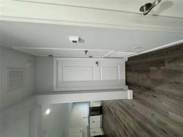 a view of storage and utility room with wooden floor