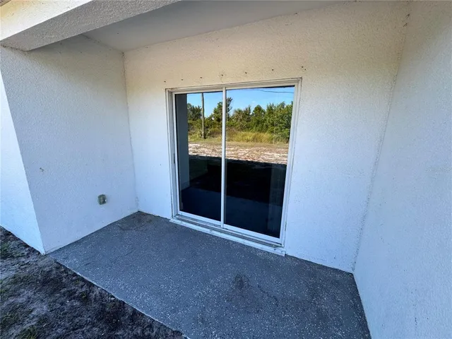 a view of an empty room with a sliding door