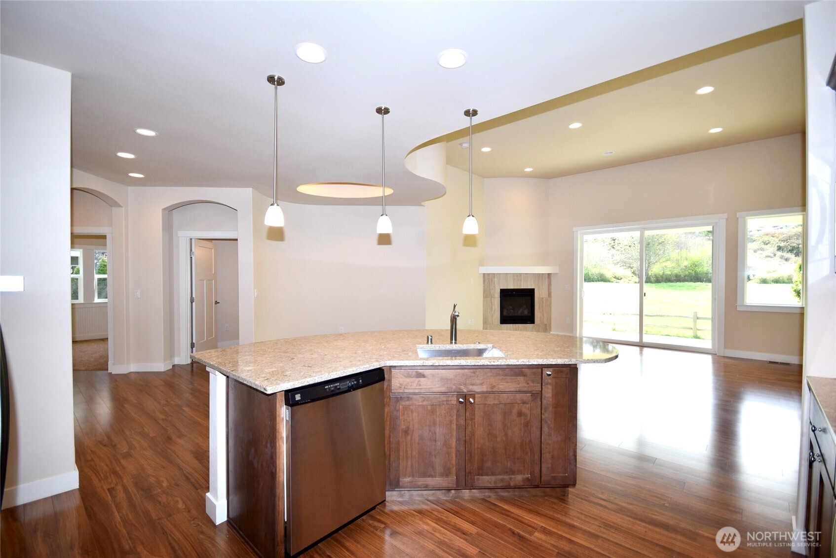 261 Mt Baker Drive, Unit B Sequim, WA 98382 - Photo 12 of 28 a kitchen with a sink and a large window