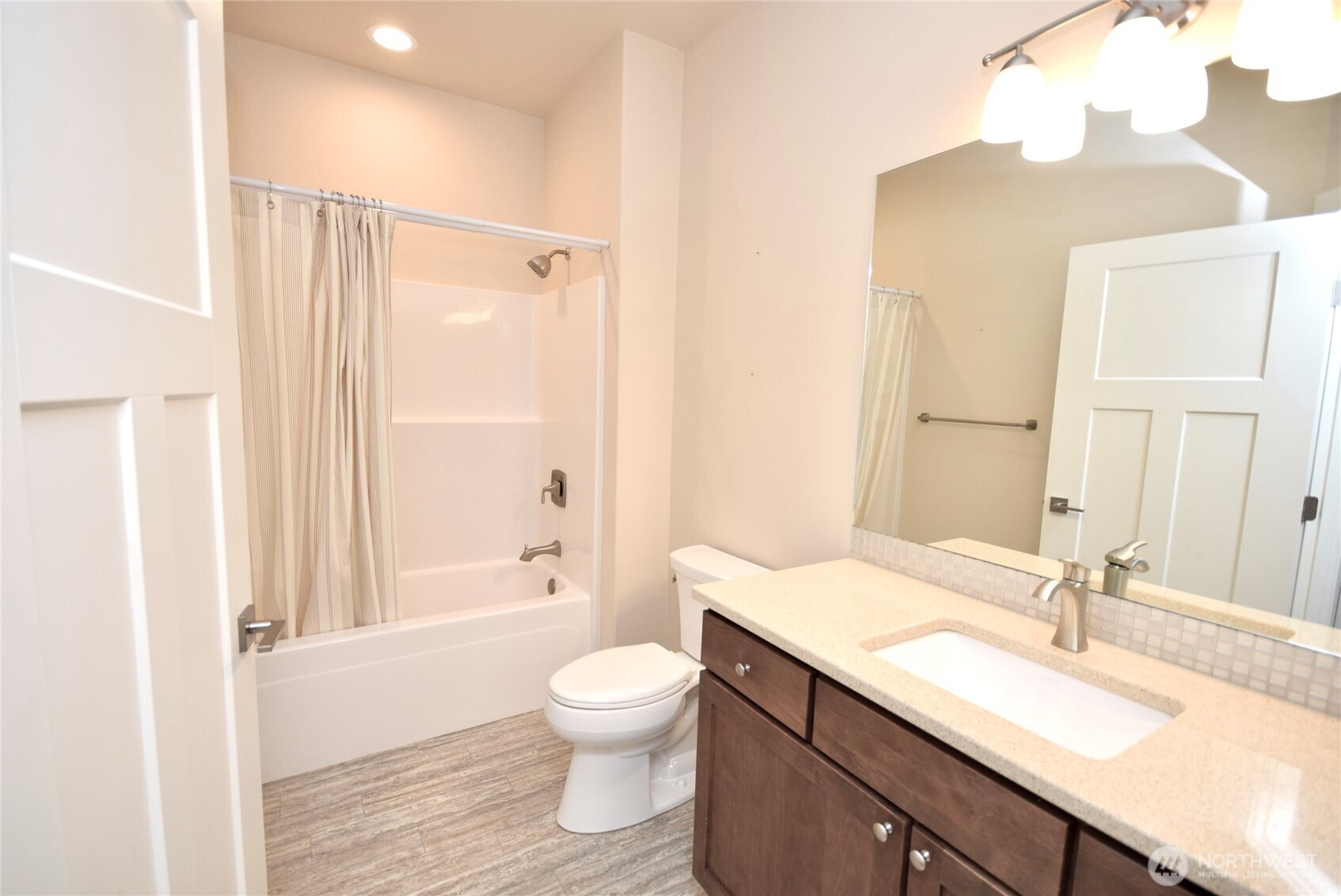 261 Mt Baker Drive, Unit B Sequim, WA 98382 - Photo 22 of 28 a bathroom with a granite countertop sink toilet and shower