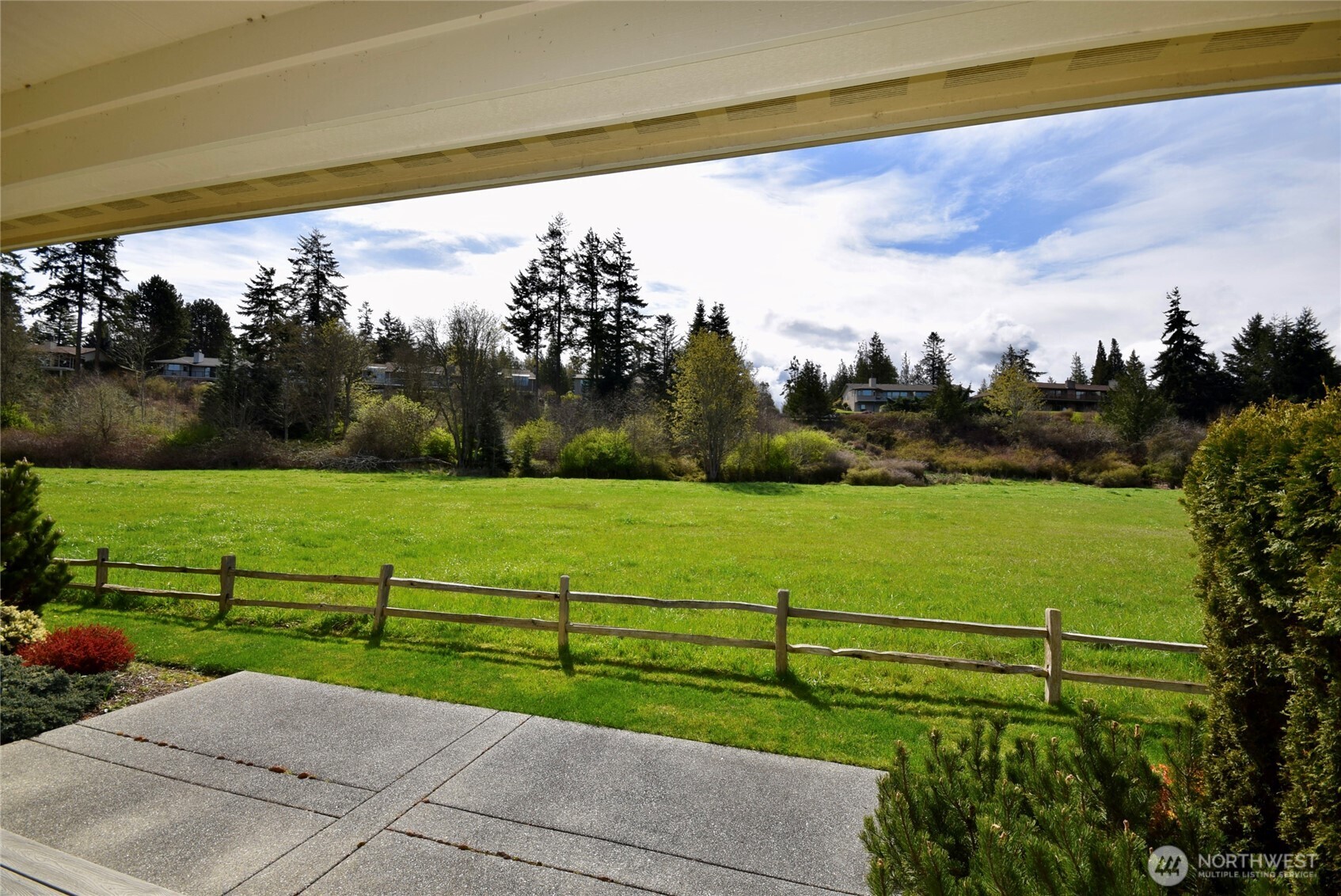 261 Mt Baker Drive, Unit B Sequim, WA 98382 - Photo 26 of 28 a view of a road with a yard