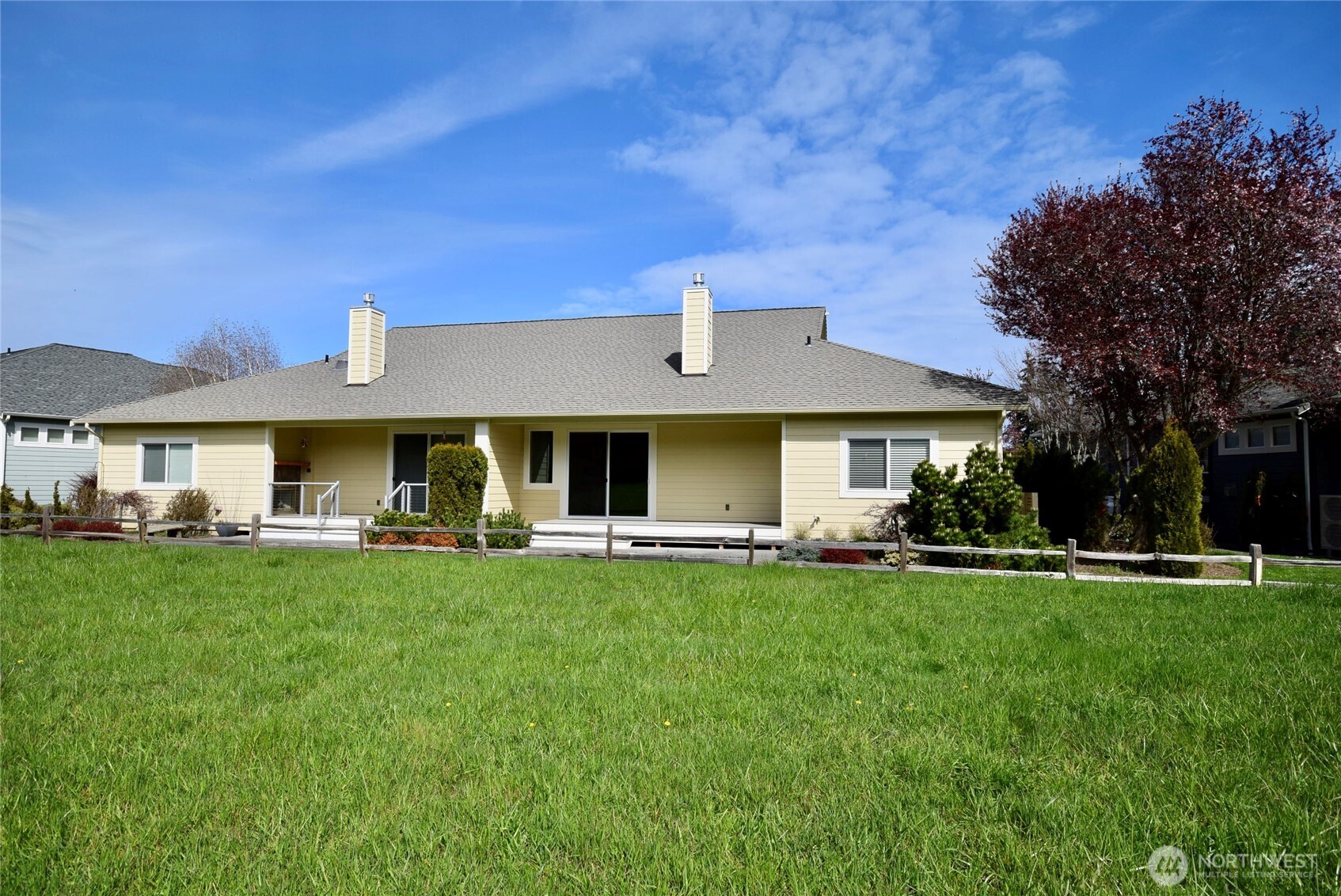 261 Mt Baker Drive, Unit B Sequim, WA 98382 - Photo 28 of 28 a front view of a house with a garden