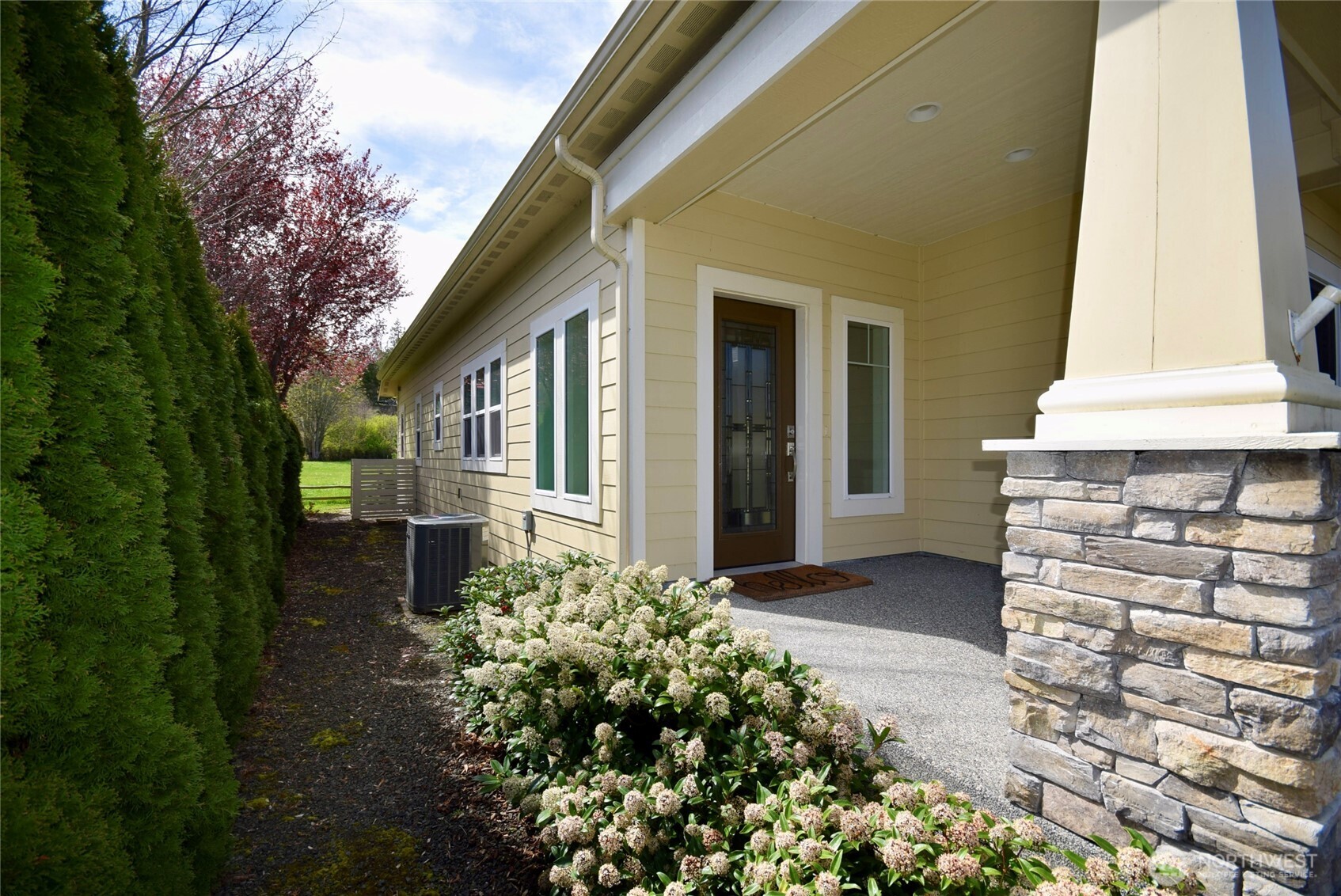 261 Mt Baker Drive, Unit B Sequim, WA 98382 - Photo 4 of 28 a view of a house with a yard