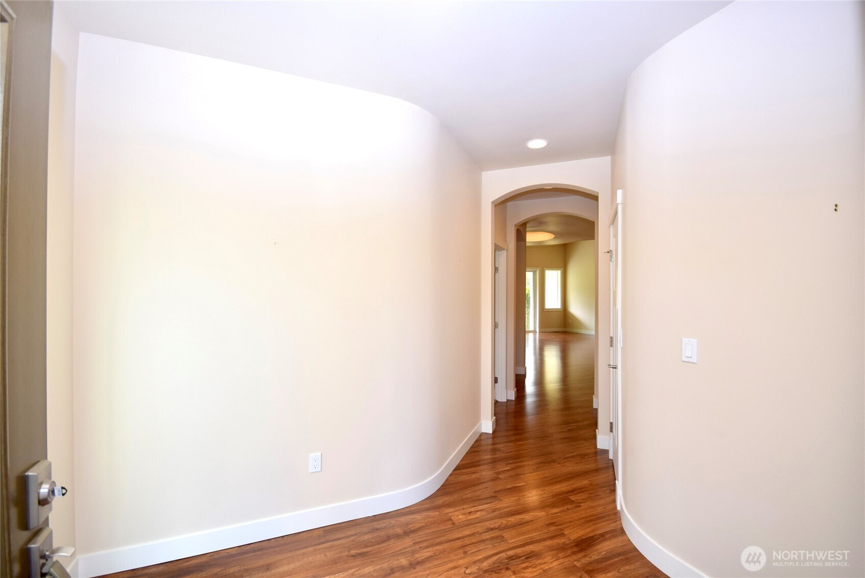 261 Mt Baker Drive, Unit B Sequim, WA 98382 - Photo 5 of 28 a view of a hallway with wooden floor