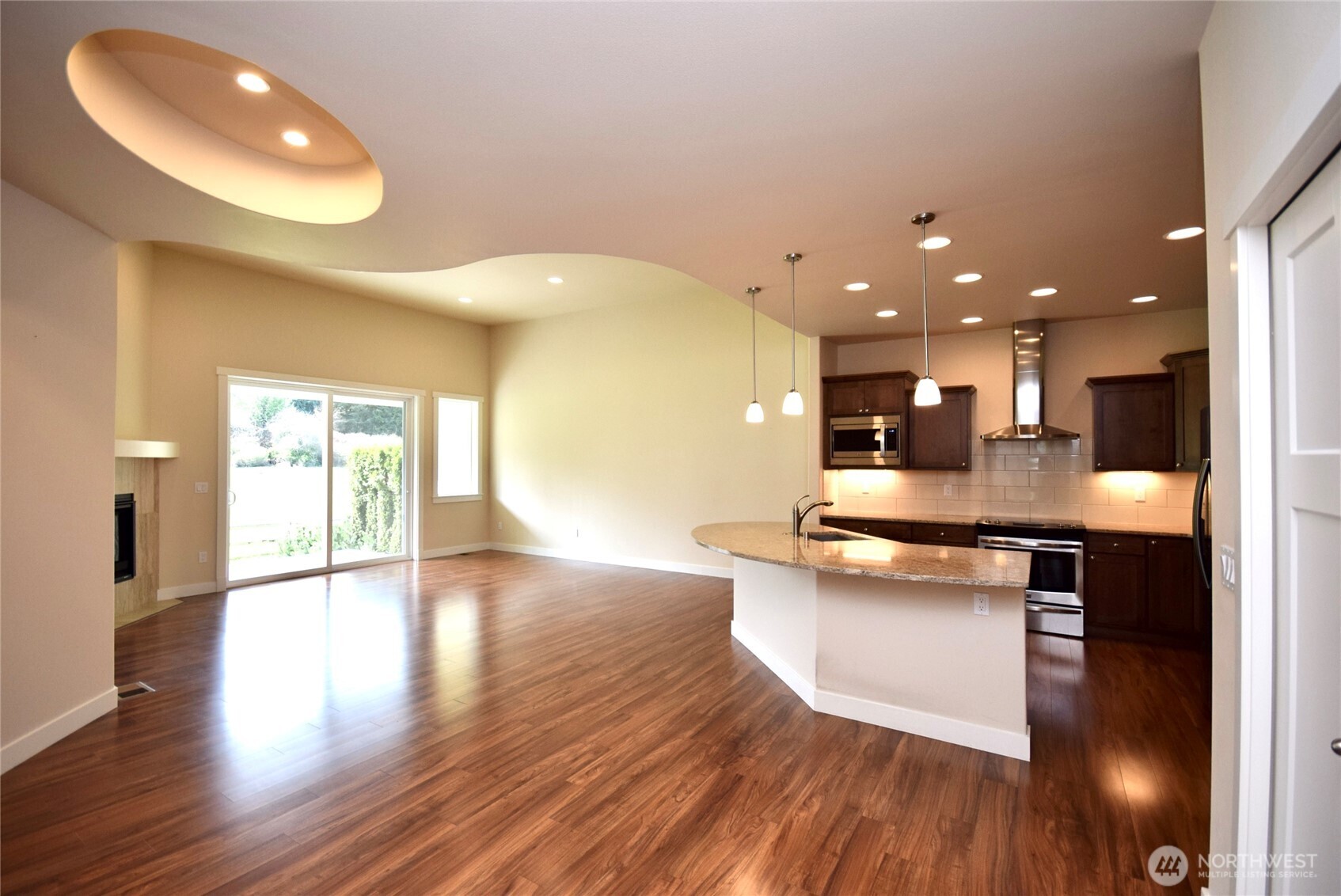 261 Mt Baker Drive, Unit B Sequim, WA 98382 - Photo 8 of 28 a kitchen with a sink and wooden floor