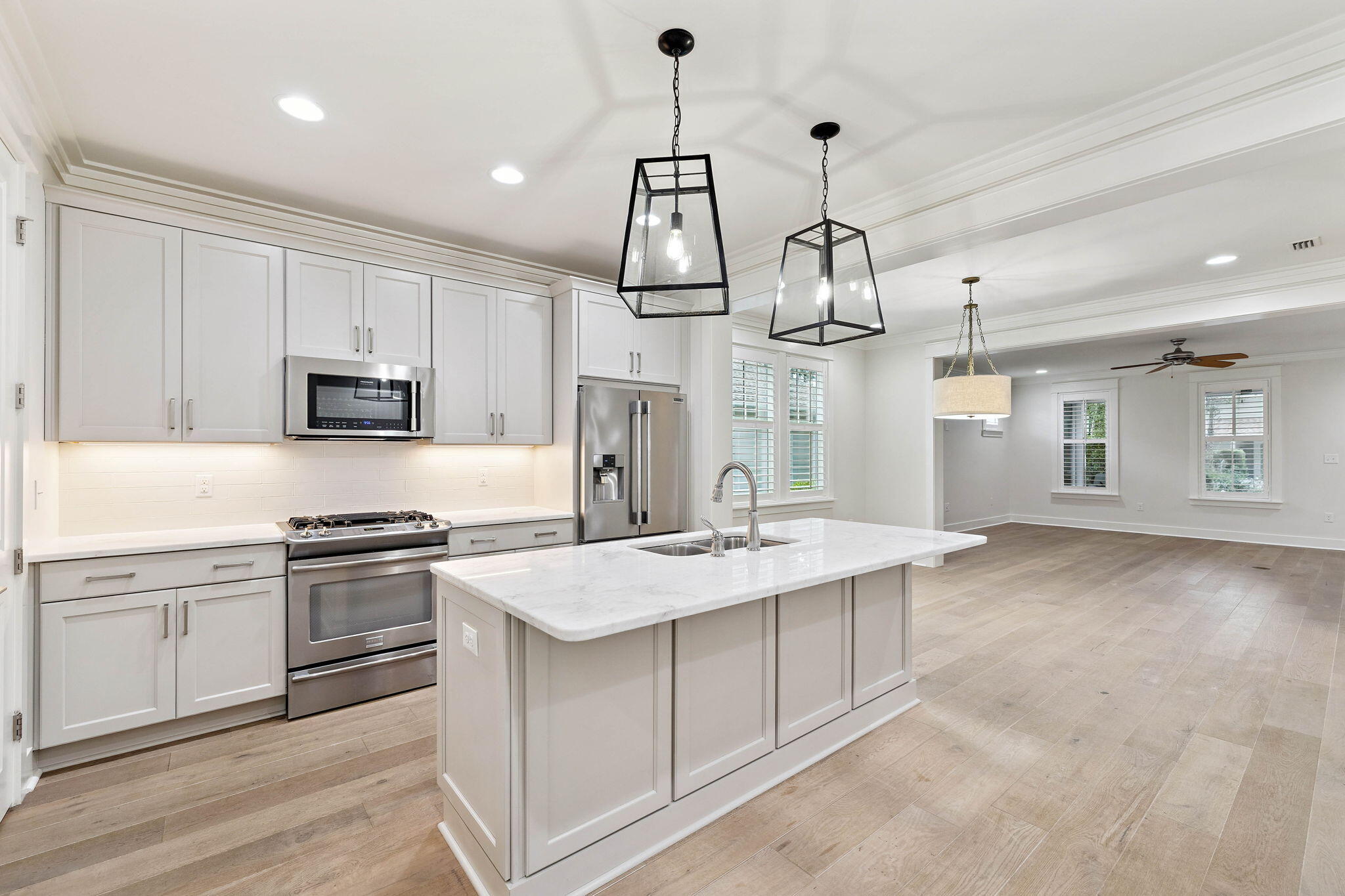 167 Jack Knife Drive Inlet Beach, FL 32461 - Photo 5 of 40 a kitchen with stainless steel appliances granite countertop a sink a stove a refrigerator cabinets and chairs
