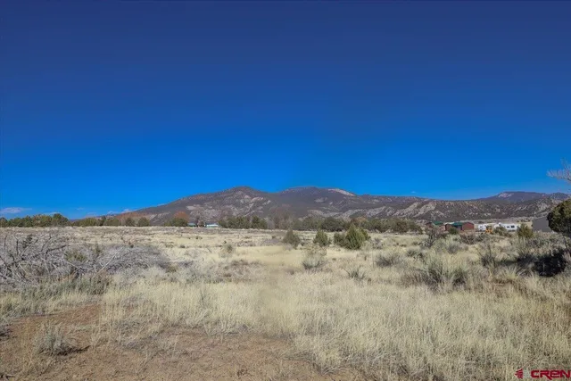 a view of mountain view with trees