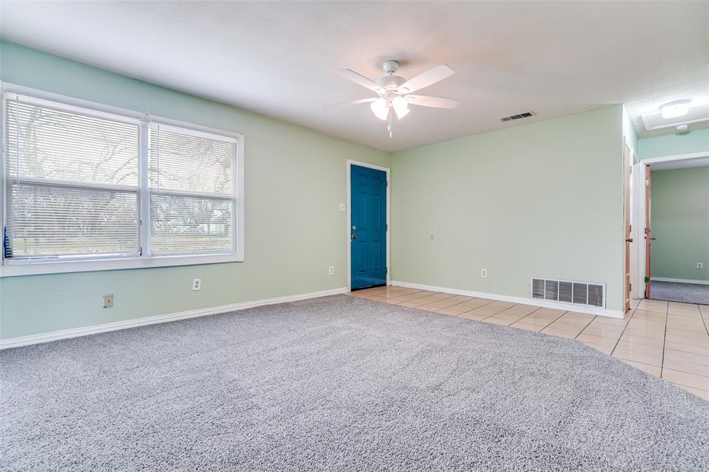 4022 Baker Avenue Dallas, TX 75212 - Photo 3 of 18 an empty room with chandelier fan and windows