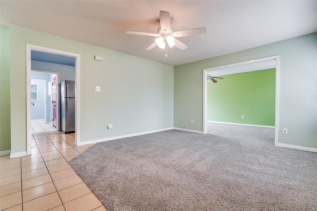 4022 Baker Avenue Dallas, TX 75212 - Photo 8 of 18 a view of a livingroom with a chandelier fan and windows