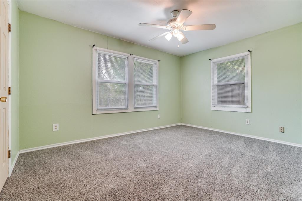 4022 Baker Avenue Dallas, TX 75212 - Photo 9 of 18 an empty room with windows and fan