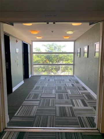 a view of balcony with a yard