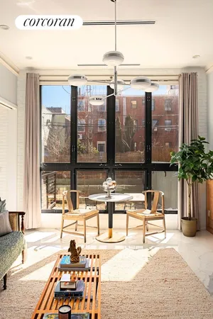 a living room filled with furniture and a table