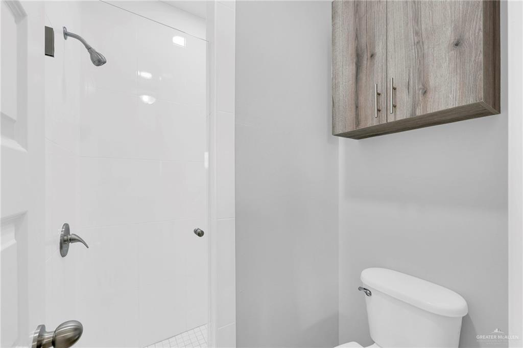 600 Bridget Street Weslaco, TX 78596 - Photo 11 of 23 a bathroom with a toilet and a shower