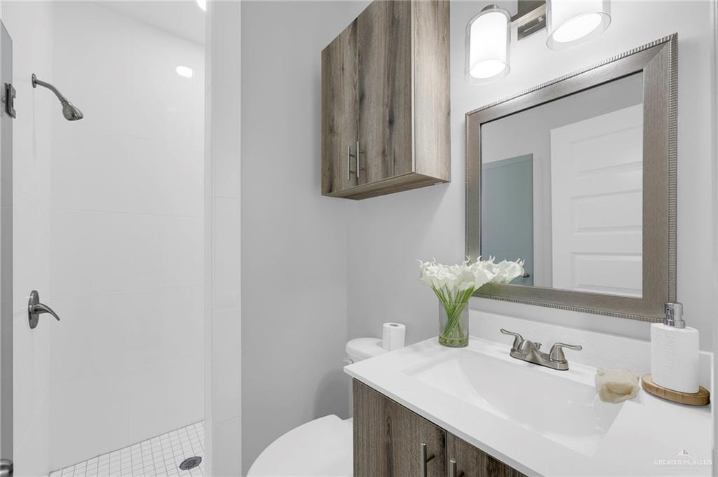 600 Bridget Street Weslaco, TX 78596 - Photo 13 of 23 a bathroom with a sink and a mirror