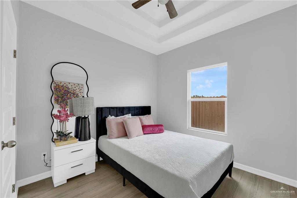 600 Bridget Street Weslaco, TX 78596 - Photo 15 of 23 a bedroom with a bed and a large window