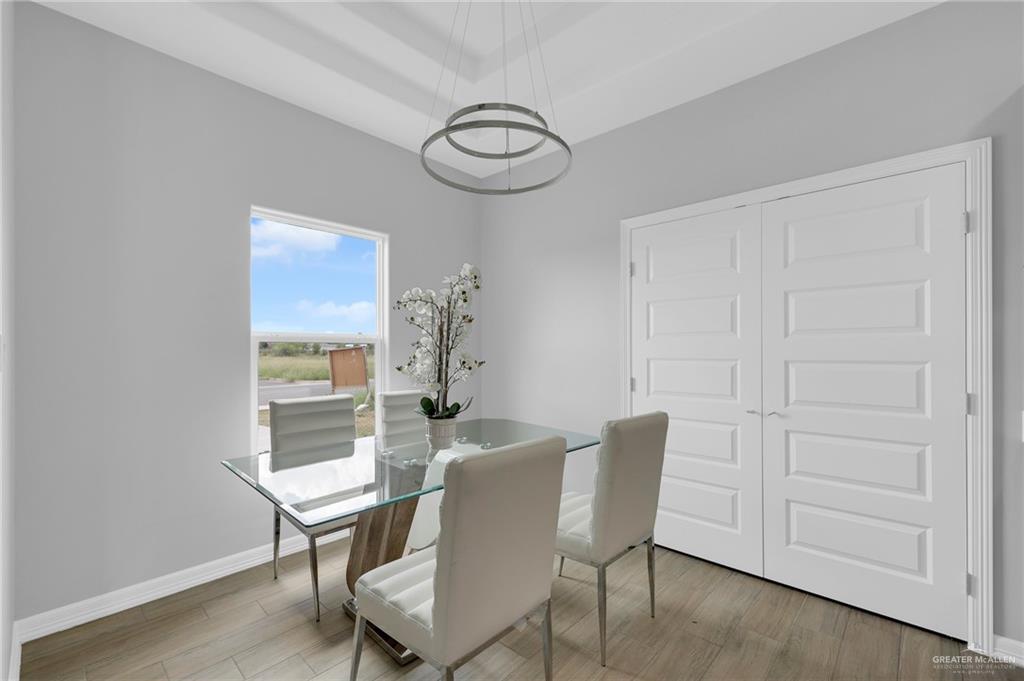 600 Bridget Street Weslaco, TX 78596 - Photo 6 of 23 a view of a dining room with furniture window and wooden floor