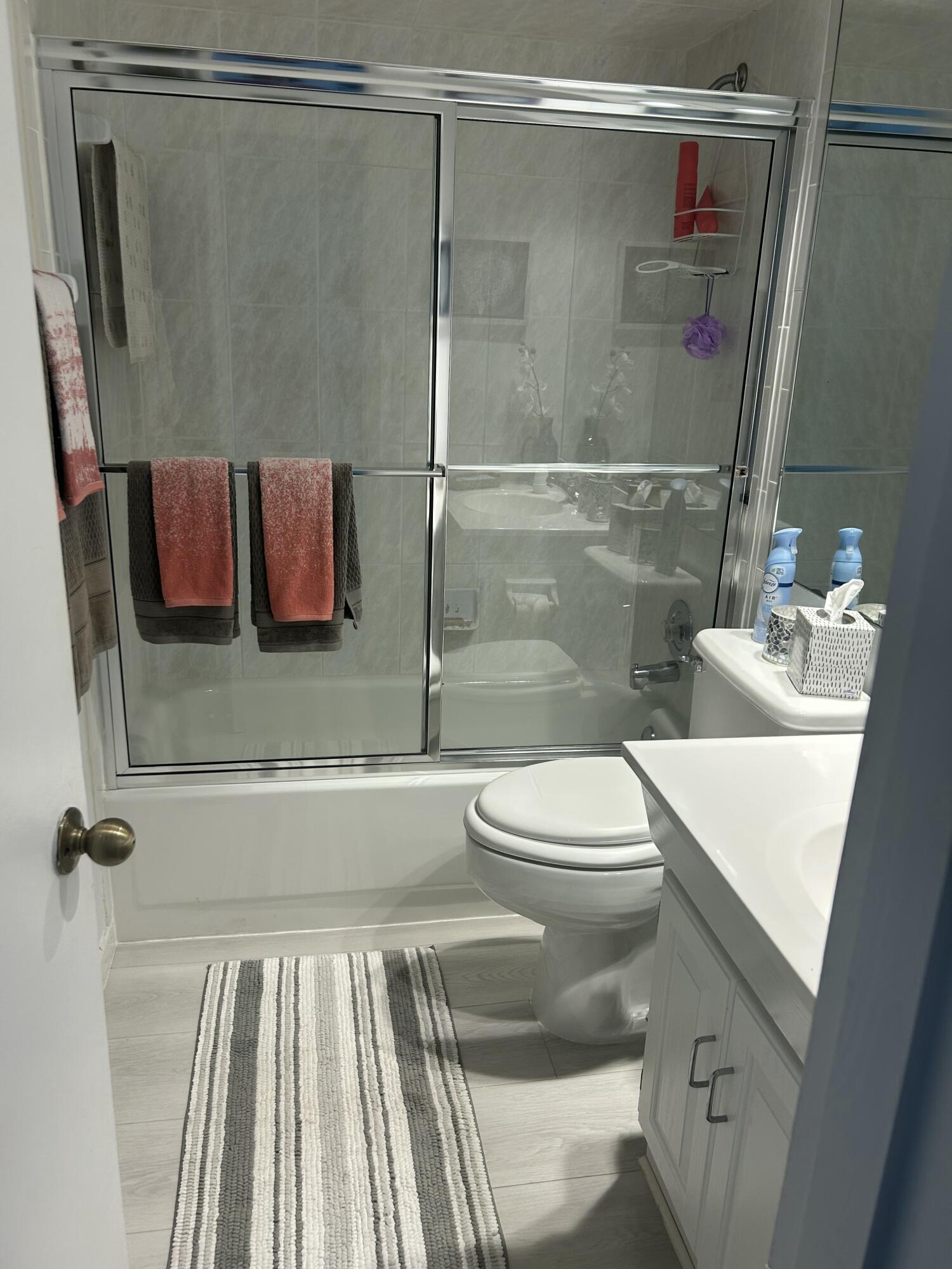 2760 Banyan Road, Unit 25A Boca Raton, FL 33432 - Photo 7 of 12 a bathroom with a sink and a mirror