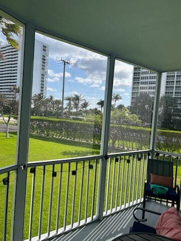 2760 Banyan Road, Unit 25A Boca Raton, FL 33432 - Photo 9 of 12 a view of a balcony with furniture