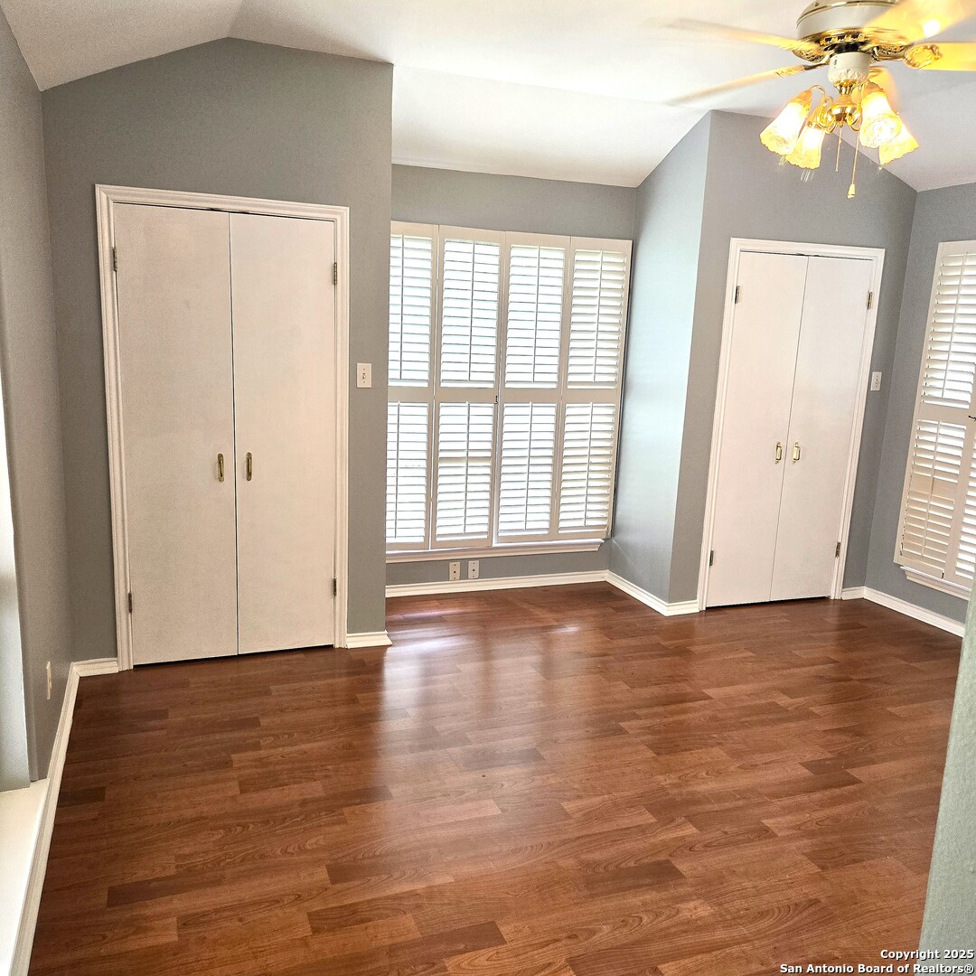 23007 South Breeze Street San Antonio, TX 78258 - Photo 15 of 27 a view of an empty room with window and wooden floor