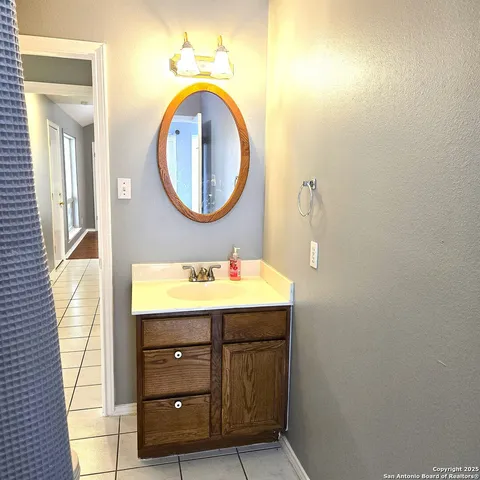 a bathroom with a sink a mirror and a toilet