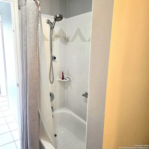 a bathroom with a white bath tub