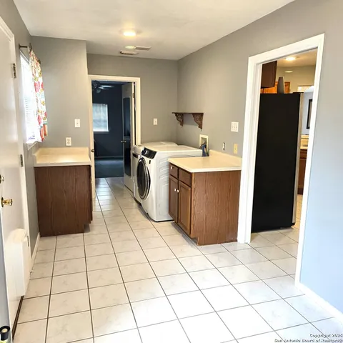 a spacious bathroom with a shower a mirror and bathtub