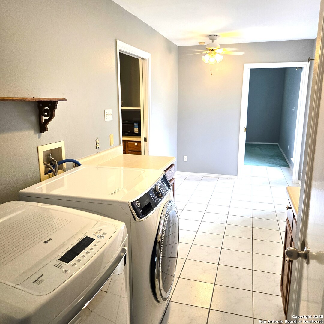 23007 South Breeze Street San Antonio, TX 78258 - Photo 23 of 27 a bedroom with a bed and a mirror