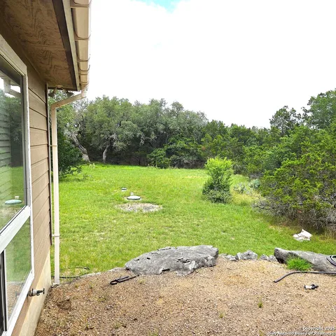a view of a yard with an outdoor space