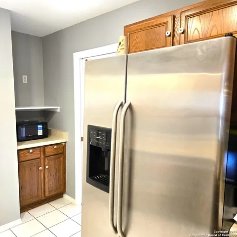 a bathroom with a shower and a sink