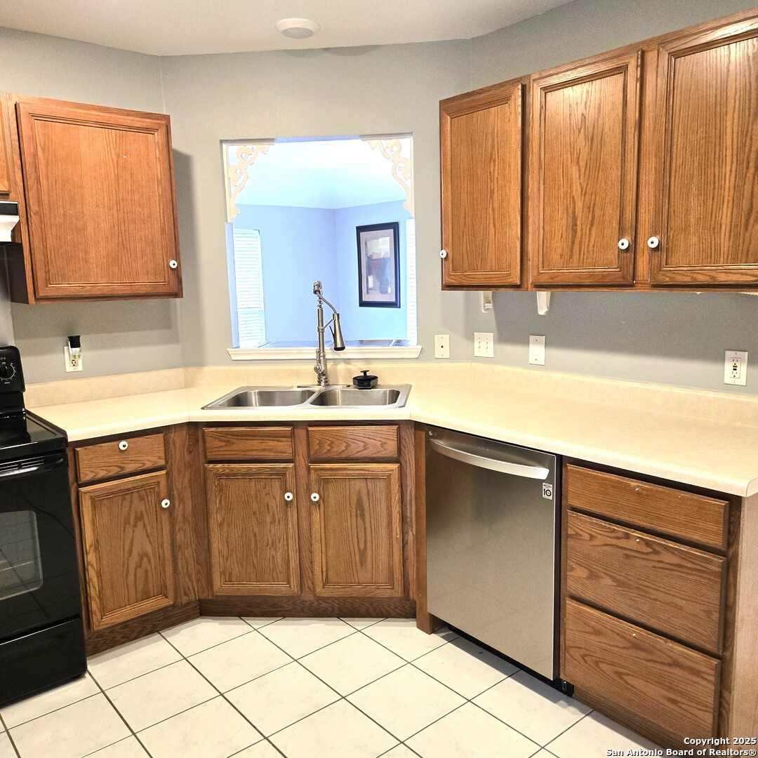 23007 South Breeze Street San Antonio, TX 78258 - Photo 7 of 27 a kitchen with a sink and a mirror