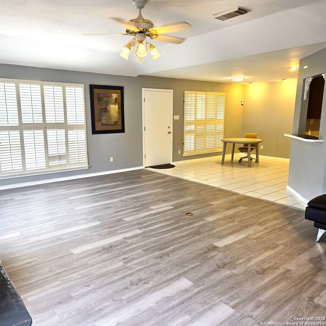 23007 South Breeze Street San Antonio, TX 78258 - Photo 10 of 27 a view of an empty room with a window and kitchen view