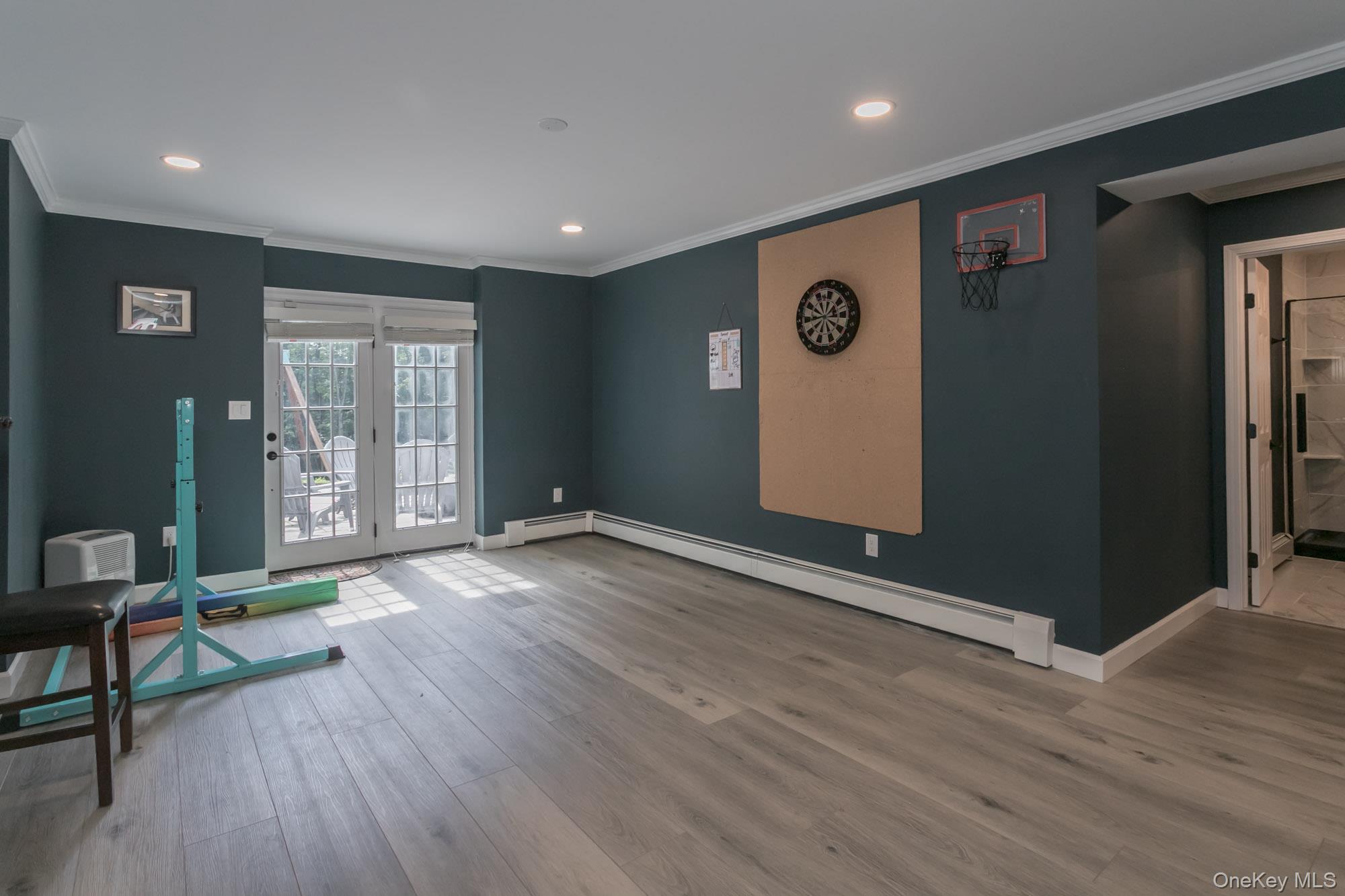 102 Beverly Road Chester, NY 10918 - Photo 41 of 49 a view of an empty room with window and wooden floor