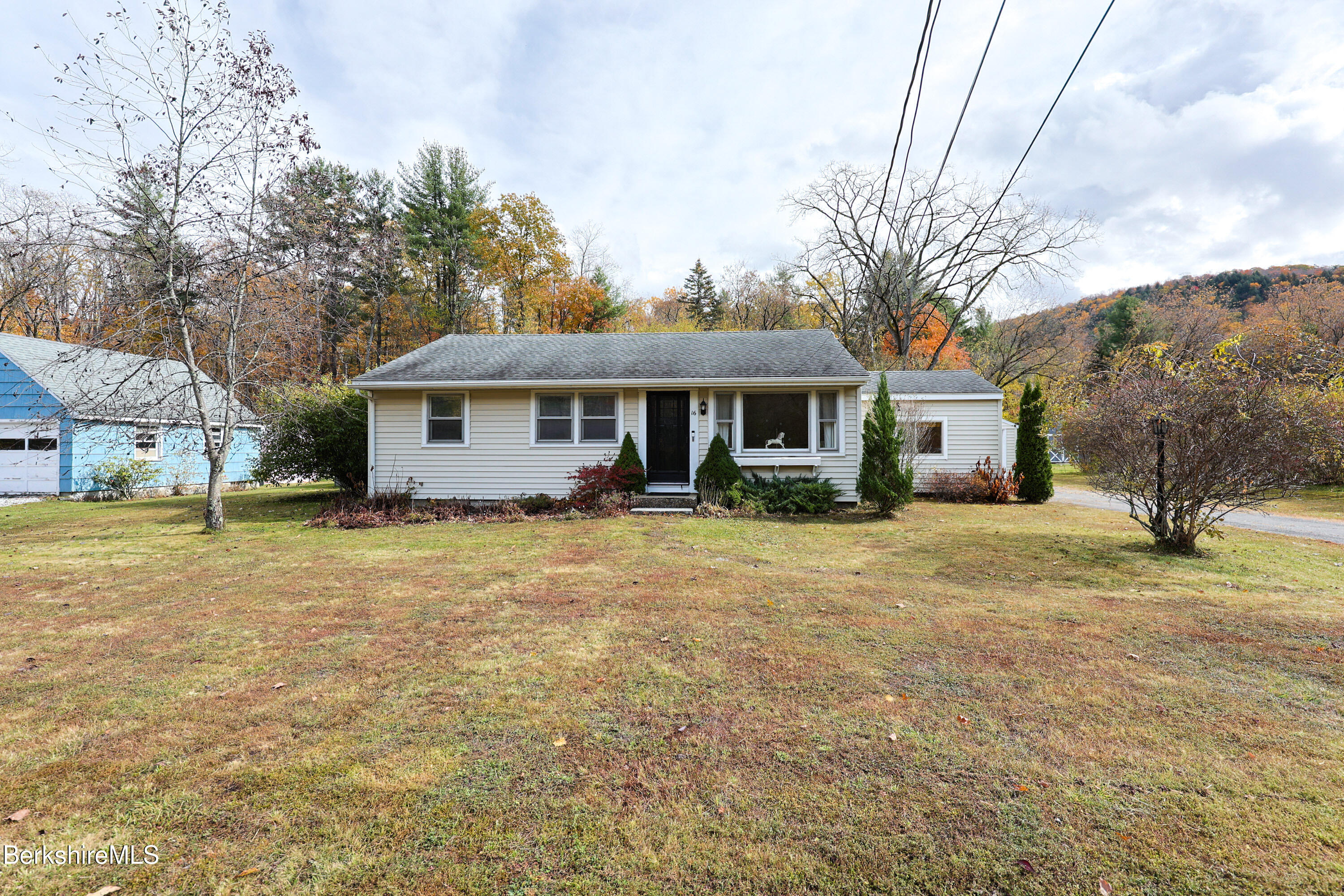 16 East New Lenox Road Lenox, MA 01240 - Photo 1 of 31 a front view of a house with a garden