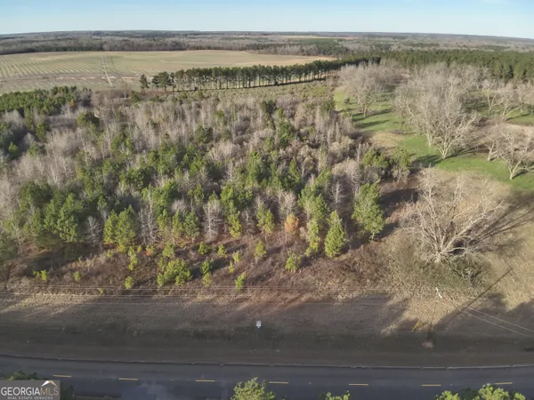 a view of a lake with beach and mountain view