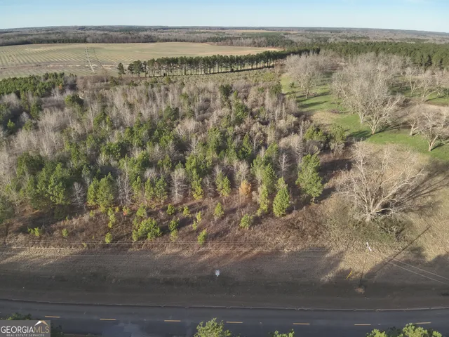 a view of a lake with beach and mountain view
