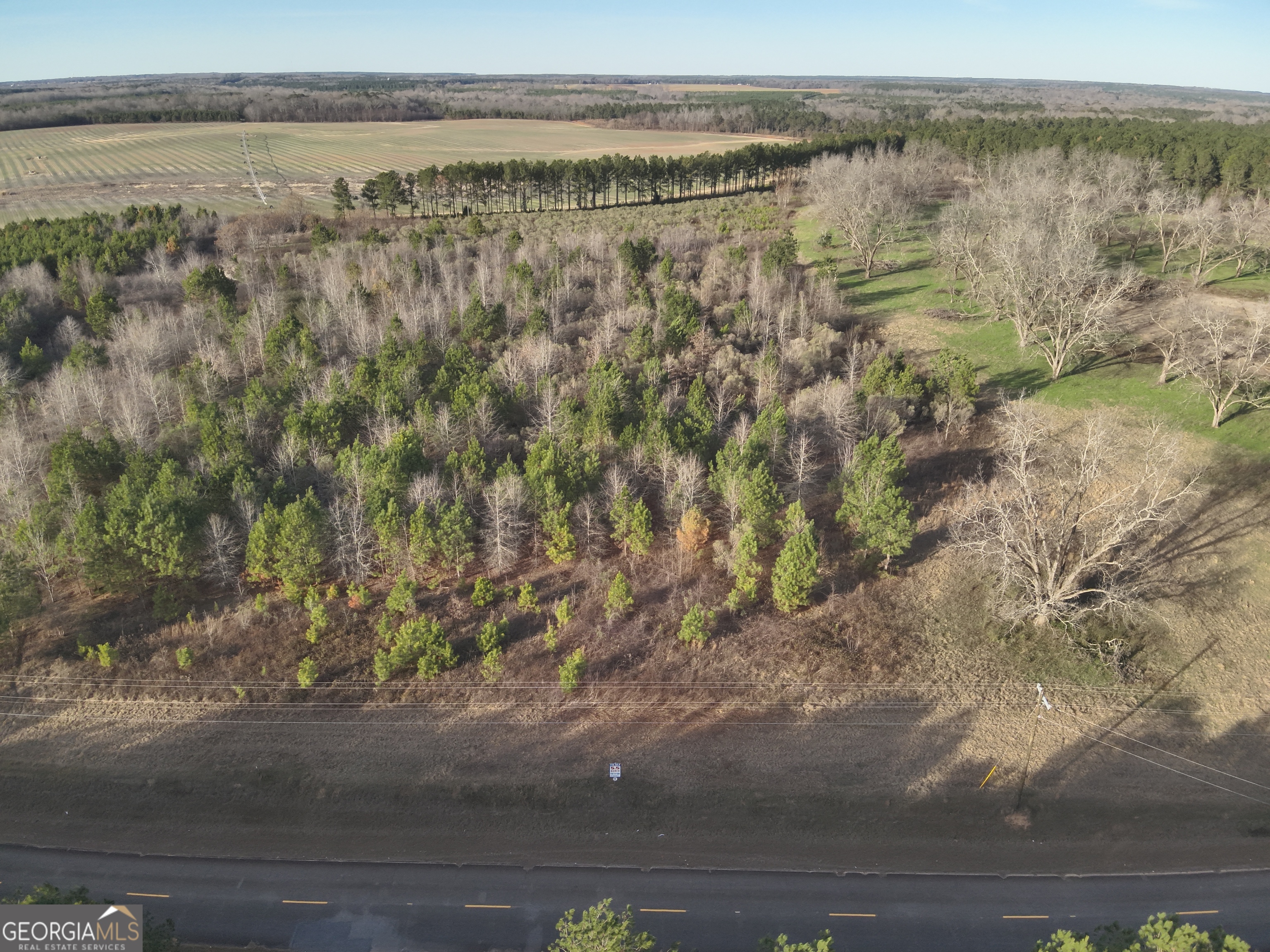 a view of a lake with beach and mountain view