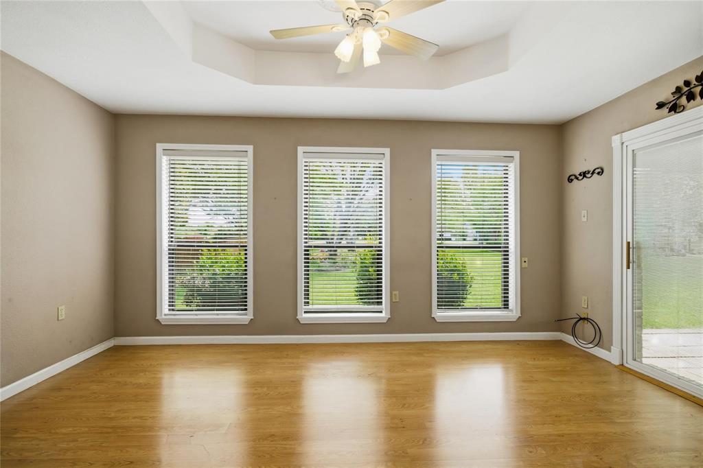 265 East Dove Road Southlake, TX 76092 - Photo 17 of 39 a view of an empty room with window and wooden floor