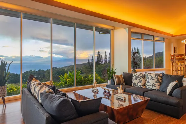 a balcony with furniture and a view of lake