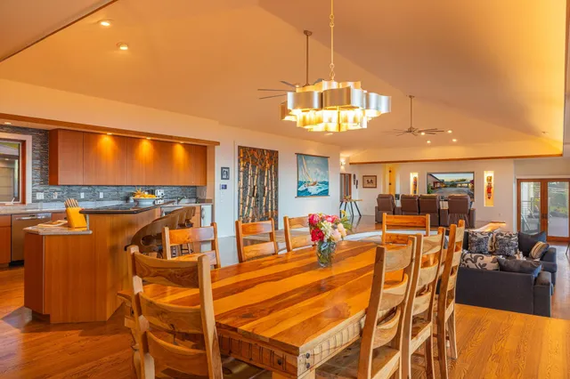a dinning area with pool table and chairs
