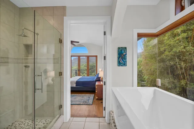 a room with a sink and a large mirror