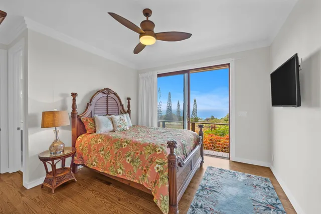 a view of a room with gym equipment and large window